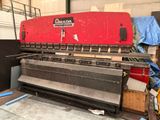 a large red machine that is sitting in a building