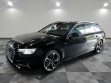 une image d'une audi wagon noire garée dans un garage