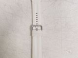 the watch strap is white and has a silver buckle on it