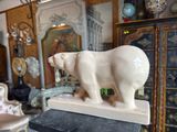 a statue of a polar bear on top of a table