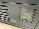 a control panel on the side of a machine