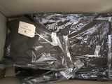 a box with a shirt in it that is wrapped in plastic