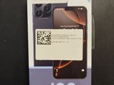 the back of a black phone with a barcode on it