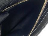 a close up of a black purse with a gold zipper