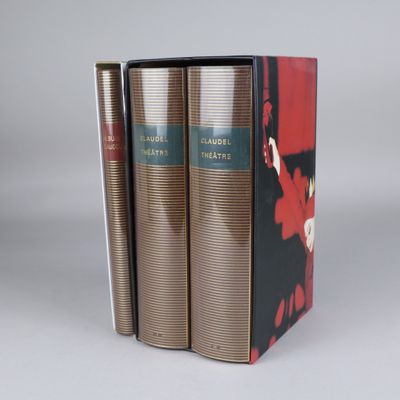 three books are stacked on top of each other on a table