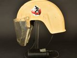 a close up of a helmet on a stand with a helmet on it