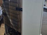 an air conditioner sitting on top of a pallet in a warehouse