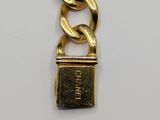 an image of a gold chain with a padlock attached to it