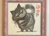 un tableau représentant un chat, accroché au mur