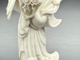 statue of a woman holding a baby in her arms