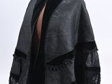 an image of a mannequin with a black jacket on it