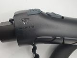 a black blow dryer sitting on top of a white table