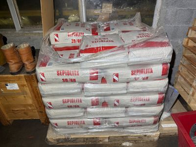a large stack of boxes sitting on top of a pallet