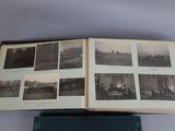 an open book on a table with pictures of people and buildings