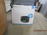a box with a printer inside of it on the floor