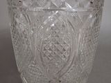 a close up of a clear glass vase on a table