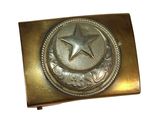 a gold belt buckle with a star on it