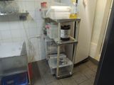 a small kitchen with a stove, sink, and refrigerator in it