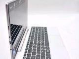 two laptops sitting side by side on a white surface