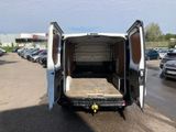 a white van that is parked in a parking lot