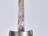 a close up of a knife on a table with a white background