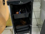 a small cart with tools on it in a room