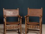 pair of antique spanish leather chairs, circa