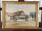 tableau représentant une maison posée sur un chevalet en bois, avec un rideau blanc en arrière-plan