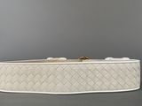 a close up of a white belt on a gray surface