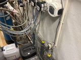 a lot of pipes that are connected to the wall