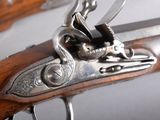 a close up of a gun that is on display
