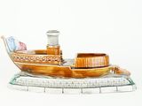 a small wooden boat with a flag on it
