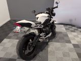 a motorcycle that is sitting on a checkered floor