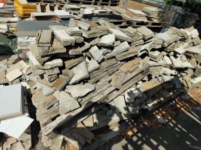 a pile of rubble on the ground next to a construction site