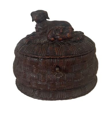 a brown box with a dog sitting on top of it