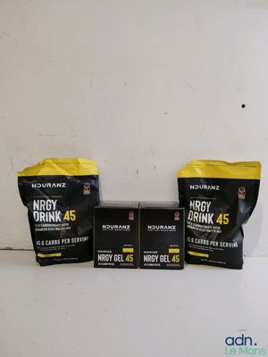 three bags of energy drink on a table next to a bag of energy drink