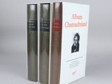 two books sitting on top of each other in front of a white background