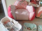 a baby ' s crib and other baby items on the floor