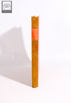 an old book that is sitting on a white surface