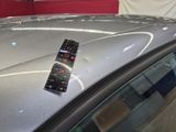 a remote control on top of a car in a showroom