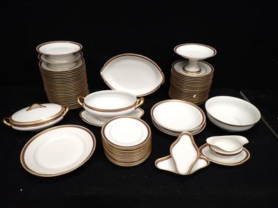 a lot of plates and bowls on a black table