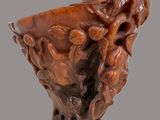 a close up of a vase with a carved design on it