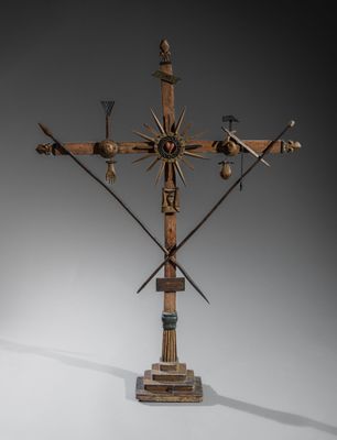 une image représentant une croix surmontée d'un bouquet de croix