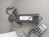 a charger that is sitting on a table next to a laptop