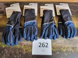 four pairs of gloves are on display on a table