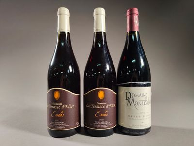 three bottles of wine are lined up on a table