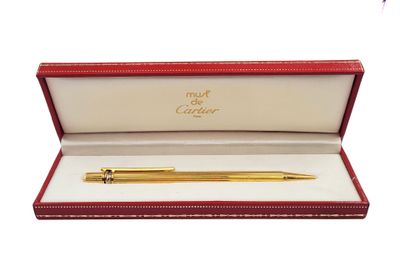 a gold pen in a red box with a white background