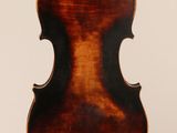 an antique violin with a wooden back and a brown body
