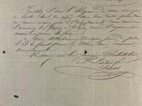 an old black and white photo of a handwritten letter on a piece of paper