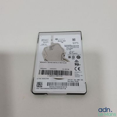 a close up of a hard drive on a white surface